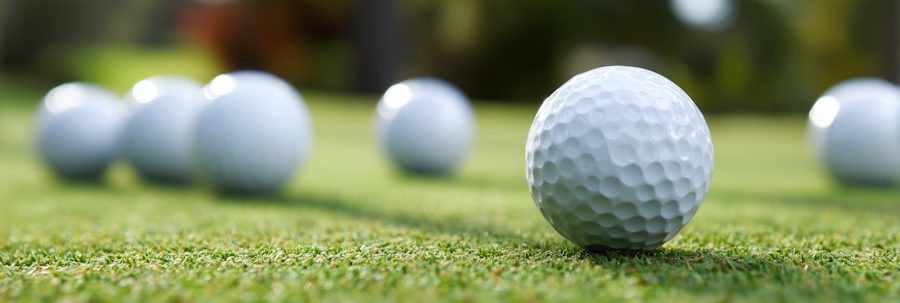 The best golf balls for high handicappers content image - golf balls on the green