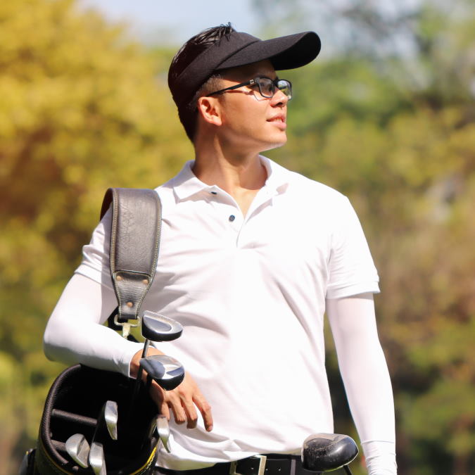 golfer on the course with bag and clubs