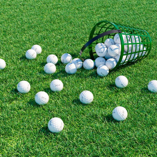 golf balls on the green in a bucket