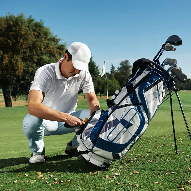 golfer with a golf bag and complete golf set