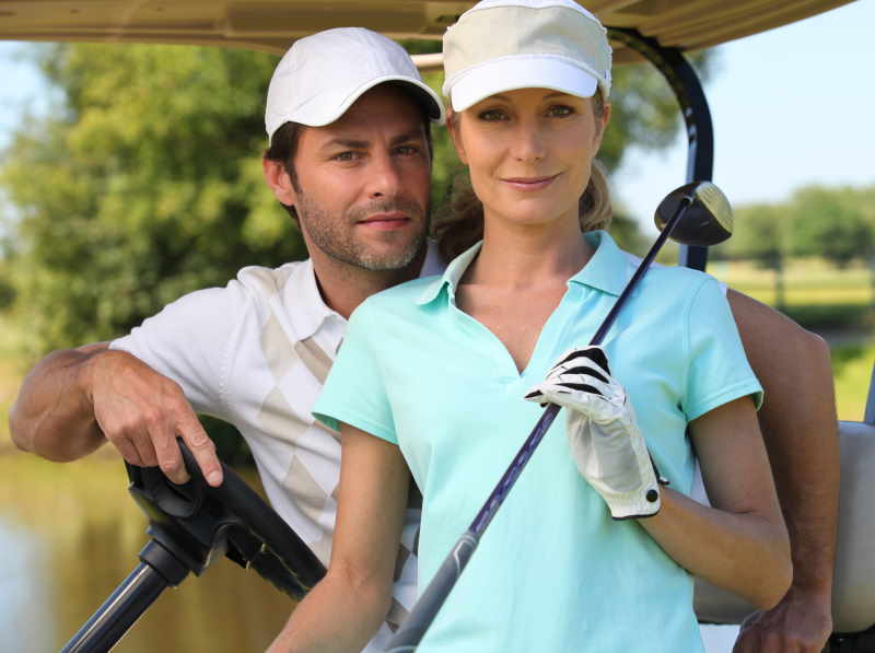 a couple golfing 
