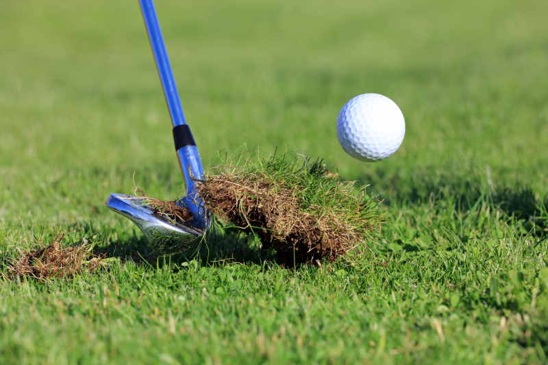 wedge golf shot hitting the turf