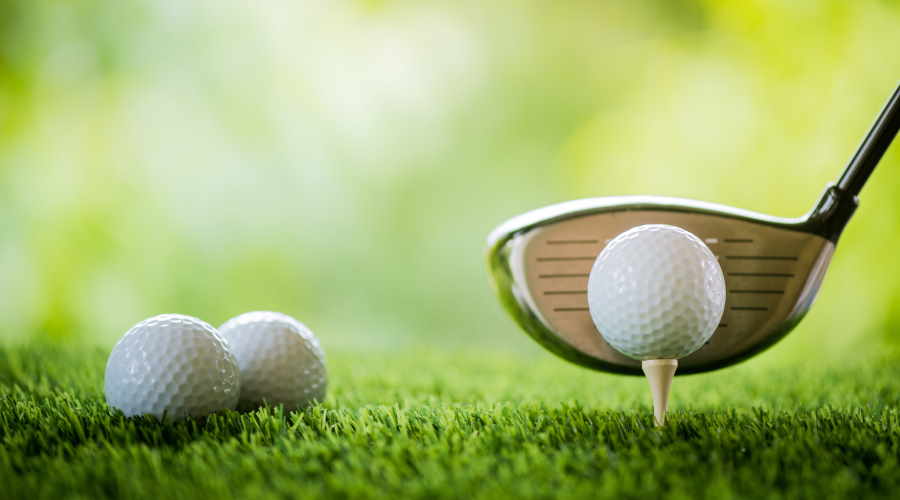 The Best Golf Clubs for Beginners, Intermediate, and Pro Golfers - driver and golf ball on a tee