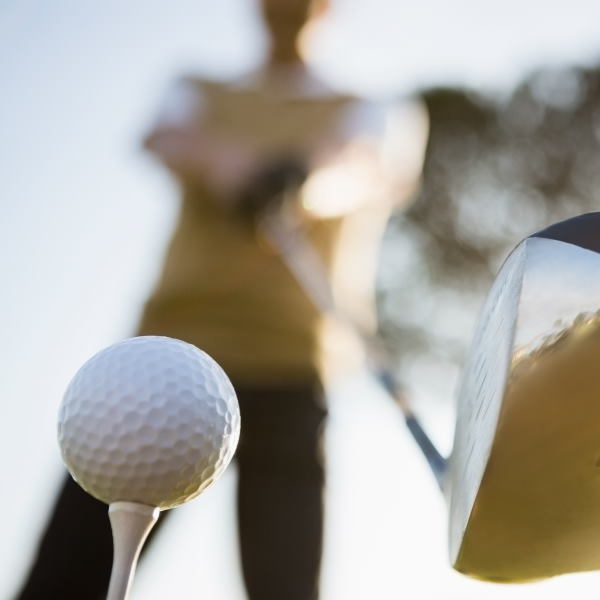 teeing up golf balls for a swing