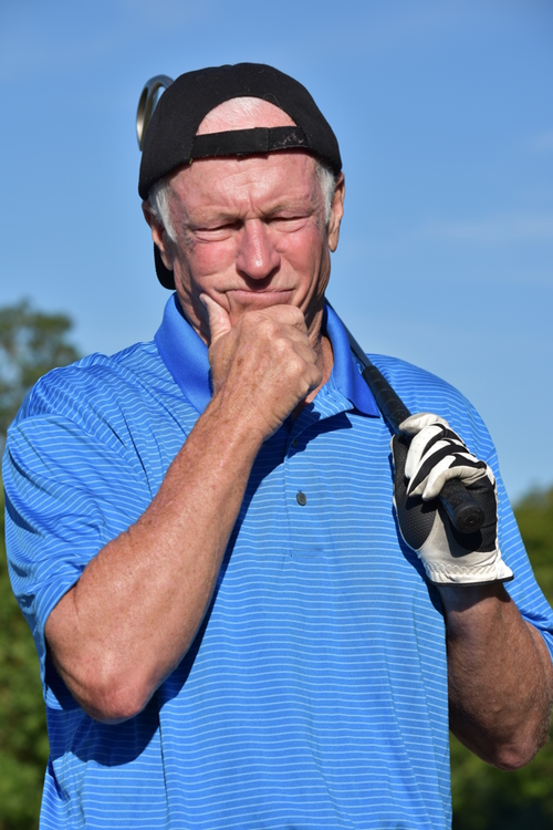 golfers' biggest regrets - man thinking on the golf course