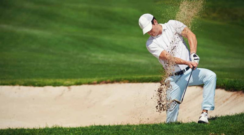 golf shot from sand bunker golfer hitting ball from hazard